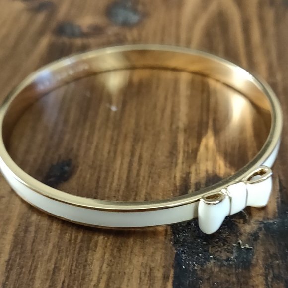 Kate Spade white and gold bow bangle